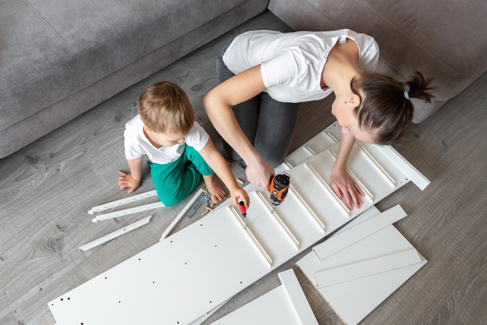 A mother and child build some new shelves together