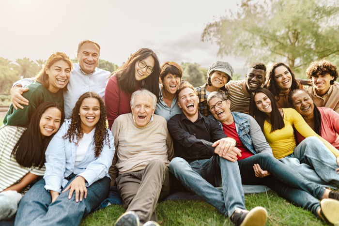 Multigeneration group of people smiling in the park