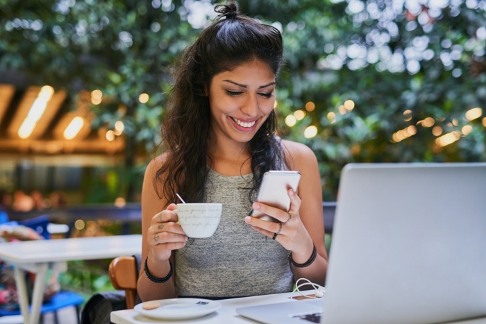 shot of a young woman using a cellphone