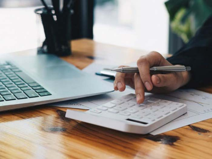 Person doing their taxes at a desk