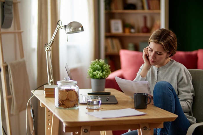 Woman Reviewing Finances in Home Office