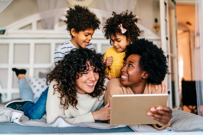 A young family reviews saving options for their children.