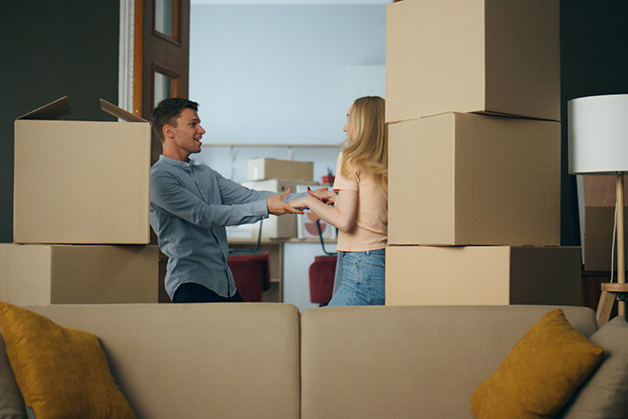 Young Couple Dancing Amid Moving Boxes
