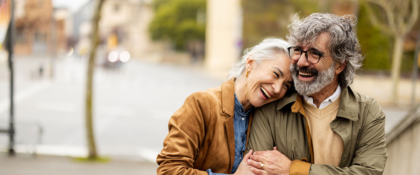 Mature couple embracing outside
