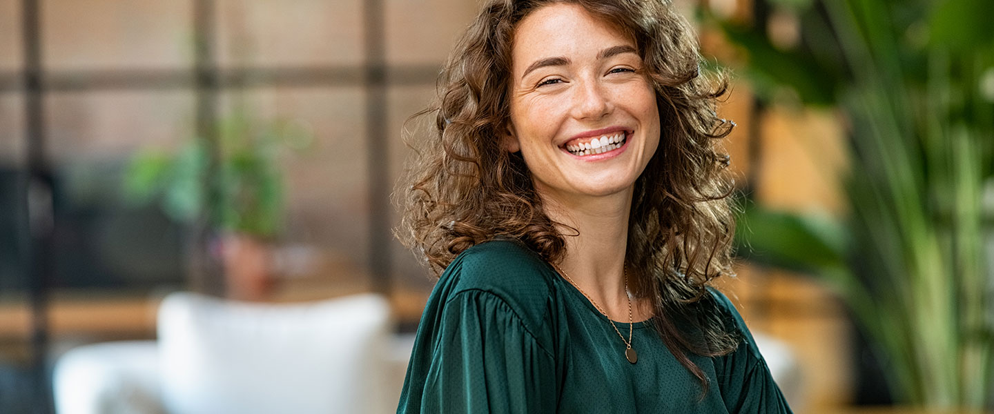 Young woman smiling looking at camera